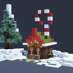 an image of a small house made out of lego blocks and trees in the snow