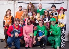 a group of people in costumes posing for a photo