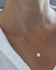 The sweetest, classic silhouette. This little recycled 14k gold droplet measures just about 3/8" by 1/4", and is accented with a tiny white diamond and hangs on a delicate cable chain. Available in 16", 18" or 20". Availability: Currently in stock and ready to ship. Dainty 14k Gold Teardrop Pendant Necklace, Dainty Yellow Gold Drop Necklace For Everyday, Delicate Yellow Gold Teardrop Charm Necklace, Delicate Teardrop Yellow Gold Charm Necklace, Delicate Yellow Gold Teardrop Pendant Charm Necklace, Minimalist Yellow Gold Teardrop Pendant Charm Necklace, Minimalist Oval Charm Necklace With Delicate Chain, Delicate Yellow Gold Drop Necklace For Everyday, Minimalist Oval Charm Necklaces With Delicate Chain