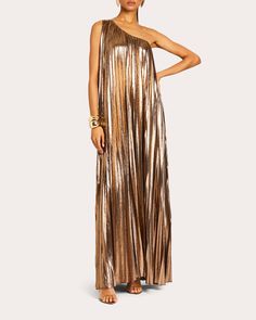 A stunning display of dimension, the Kensley dress is brought to life in metallic bronze lamé that shimmers with every movement. The loosely shaped silhouette falls in striking pleats from its asymmetric neckline to floor-sweeping hem.Pull-onAsymmetric necklinePleatedMetallic lamé95% polyester, 5% spandexDry cleanMade in China Size & Fit Model (wearing size S): 5ft 10in tall Size XS (US 0-2): 32.5-33.5in bust, 25-26in waist, 36-37in hips Size S (US 2-4): 34-35in bust, 27-28in waist, 37-38in hips Asymmetric Neckline, Pleated Maxi Dress, Pleated Maxi, Curvy Dress, Guest Dresses, Dresses Xs, Evening Dress, Polyester Spandex, Fashion Inspo Outfits