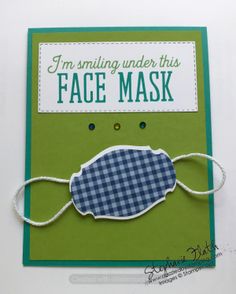 a handmade card with an image of a face mask and the words i'm smiling under this face mask