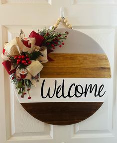 a welcome sign hanging on the front door