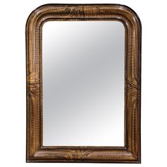 a large wooden frame mirror on a white background