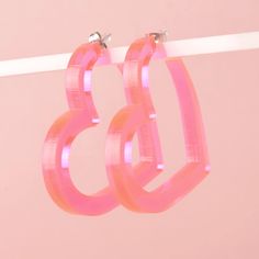 Big, playful, fluorescent pink heart shaped hoop earrings. Made of light-weight acrylic and stainless steel earring posts. Earring size: 2 x 1.9 x .25 in Oc Fashion, Pink Earring, Glowforge Projects, Shaped Hoop Earrings, Pink Heart Earrings, Makeup Accesories, Heart Hoop Earrings, Zoom Call, Full Of Love