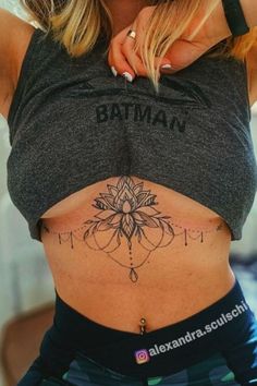 a woman with a tattoo on her stomach