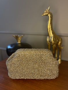 If you're looking for a glamorous and trendy accessory for your next party or event, a glitter party clutch bag made with sparkle yarn may be a perfect choice.  The use of sparkle yarn in the design of the clutch bag makes it perfect for adding some shine and glam to your outfit. The bag is covered in glitter which shimmers and reflects light beautifully, making it a great accessory for special occasions like weddings, parties, and proms. The glitter party clutch bag has a classic and timeless d Gold Clutch Bag, Crochet Clutch Bags, Woven Clutch, Sparkle Yarn, Glitter Clutch, Cloud Bag, Crochet Clutch, Glitter Party, Party Clutch