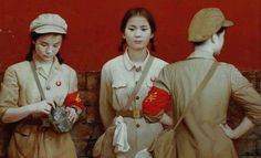 three women in uniforms standing next to each other