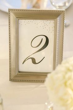 the table numbers are displayed in silver frames