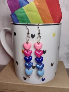 Show your omnisexual pride with these beaded earrings, featuring heart-shaped pony beads representing the colors of the omnisexual pride flag! Can't find your flag? Prefer a different style? Shoot us a message to inquire about a custom order! All of our earrings are nickel and lead free and sanitized before shipping to you. Omnisexual Earrings, Omnisexual Jewelry, Adjustable Multicolor Heart Earrings For Valentine's Day, Genderfluid Pride, Star Candy, Quirky Jewelry, Pride Outfit, Pony Beads, Pride Flags