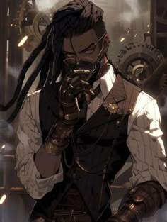 a man with dreadlocks is holding his hand to his face while standing in front of machinery