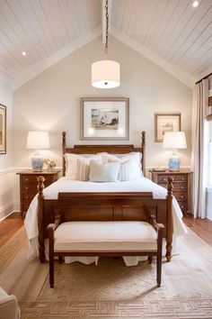 a bedroom with white walls and wooden furniture