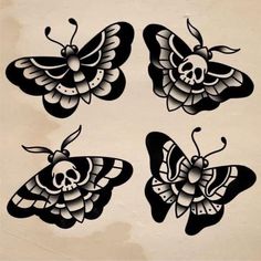 four black and white butterflies with skulls on them