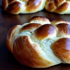 bread rolls sitting on top of a wooden table