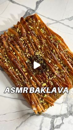 an image of food that is on top of a marble counter with the words asmr bakalava above it