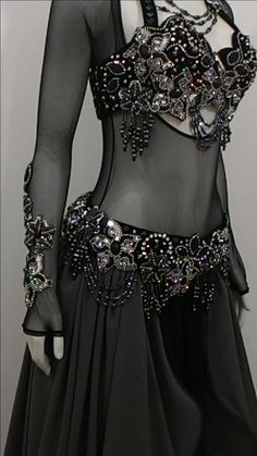 a black dress with silver beads on it