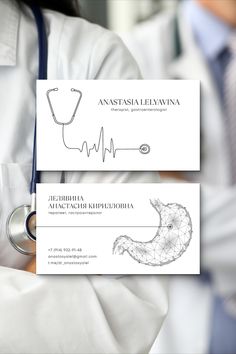 a doctor holding up two business cards with an image of a heart beat on it