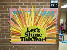 a bulletin board that says let's shine this year