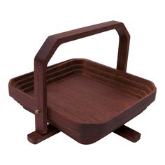 a wooden tray with two handles on each side and one holding a plate in the middle