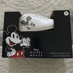 New In Box Disney Mickey Mouse Ladies Character Court Sneakers Size 9 Black Mickey On Side Of Sneaker Box May Be A Little Scratched But Shoes Brand New Disney White Low-top Sneakers, Sporty Mickey Mouse Synthetic Sneakers, White Disney Sneakers In Synthetic Material, White Disney Synthetic Sneakers, Black Mickey Mouse Sneakers For Streetwear, White Sporty Mickey Mouse Sneakers, Sporty White Mickey Mouse Sneakers, White Low-top Mickey Mouse Sneakers, Disney White Sneakers With Mickey Mouse Detail