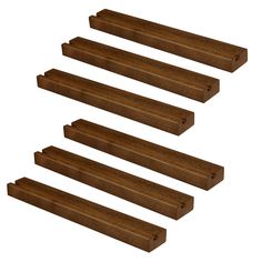 four pieces of wood sitting next to each other