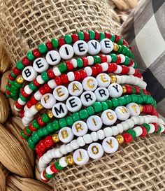 the beaded bracelets have words written on them