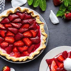 a pie with fresh strawberries on top