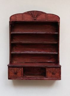 a wooden shelf with two drawers on it