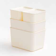 three white containers stacked on top of each other