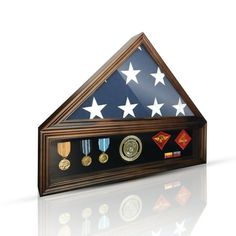 This Military Shadow Box Display Case is the perfect way to honor and remember the service of American veterans. Made of solid wood and glass, it is built to last and stand the test of time. The case is large enough to hold a folded 5x9.5' flag, medals, and patches, so you can create a truly meaningful and personalized tribute. The case is designed to be both free-standing and wall-mounted, giving you the flexibility to display it in any room of your home. Whether you choose to place it on an en Military Shadow Box, Flag Display Case, Shadow Box Display Case, Flag Display, Military Medals, Box Display, American Veterans, Shadow Boxes, Display Case