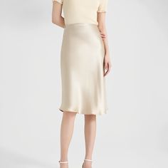 A person dressed in a light-colored Short Silk Skirt, Halter Dress Short, Silk Midi Skirt, Tube Top Dress, Maxi Dress Cocktail, Cardigan Sweater Dress, Dress Bra, Silk Slip, Silk Skirt