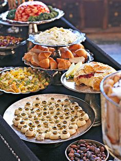 a buffet table filled with different types of food