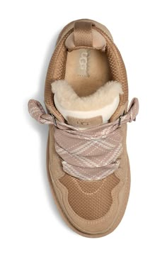 Geometric designs enliven the wide laces of this chunky lace-up sneaker boasting a padded collar and a platform SugarSole outsole. Plus, the cozy lining is a moisture-wicking textile made from a wool-rich blend but crafted to feel and wear like genuine shearling. 2 1/4" heel; 1 1/2" platform (size 11) 4" shaft Removable insole Textile upper/UGGplush wool-blend lining/synthetic sole Imported Cute Nike Shoes, Kids Uggs, Cute Nikes