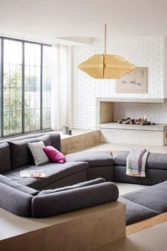 a living room filled with furniture and a fire place