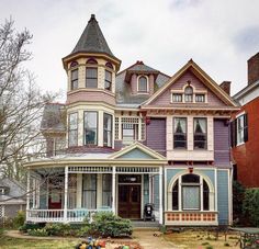 an old victorian style house with many windows