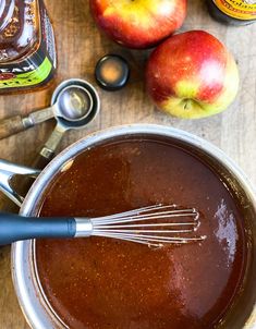 an apple cider is being used to make caramel sauce