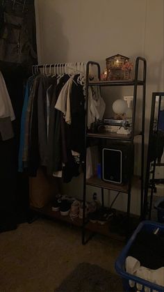 a closet with clothes and other items on it