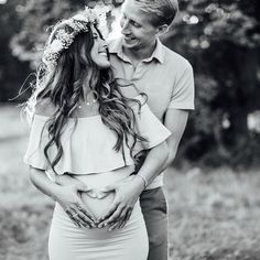 black and white photo of a pregnant couple