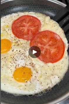 eggs and tomatoes cooking in a frying pan