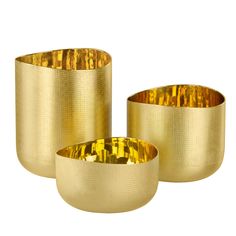 three gold - plated bowls are sitting side by side