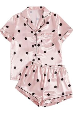 a women's pajama set with black polka dots on pink satin material