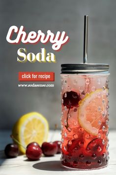 cherry soda in a mason jar with lemon wedges and cherries on the side