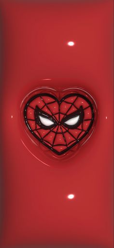 a heart shaped object with eyes in the shape of a spider - man face on a red background