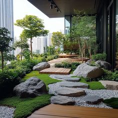 a very nice looking garden with rocks and grass