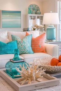 a living room filled with lots of furniture and pillows on top of a white table