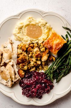 a white plate topped with different types of food