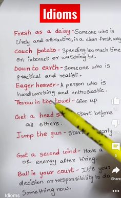 a yellow pen sitting on top of a piece of paper