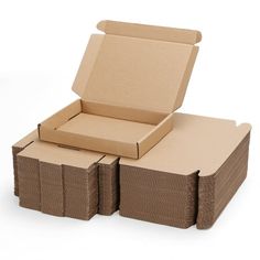 three cardboard boxes stacked on top of each other with one open box in the middle