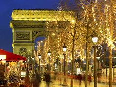 the french hits album cover with lights and trees in front of an arch at night