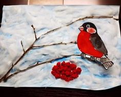 a painting of a bird sitting on a tree branch next to a heart shaped object