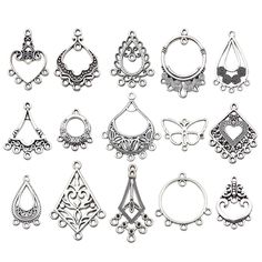 twelve pairs of earrings are shown in various styles and shapes, all with different designs on them